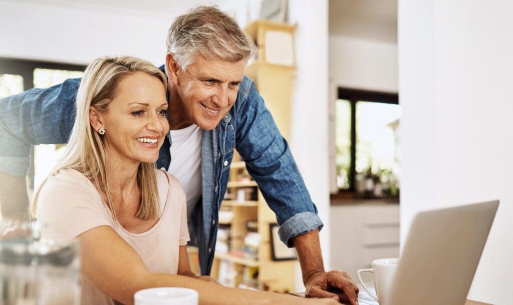 happy couple reviewing financial planning